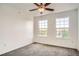 Bright bedroom featuring a ceiling fan, neutral paint, and two windows at 12711 Colorado Blvd # 607F, Thornton, CO 80241