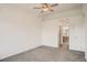Bright bedroom featuring a ceiling fan, neutral paint, and an attached bathroom at 12711 Colorado Blvd # 607F, Thornton, CO 80241