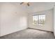 Spacious bedroom featuring a ceiling fan, neutral paint, and a large window at 12711 Colorado Blvd # 607F, Thornton, CO 80241