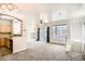 Bright living room with fireplace, large windows, and sliding glass door to balcony at 12711 Colorado Blvd # 607F, Thornton, CO 80241