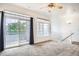 Living room with balcony, staircase, high ceiling, and large windows with great light at 12711 Colorado Blvd # 607F, Thornton, CO 80241