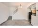 Inviting living room with staircase, chandelier and pass-through to the kitchen at 12711 Colorado Blvd # 607F, Thornton, CO 80241