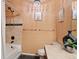 Bathroom featuring a vanity, toilet, and a shower-tub combination at 2662 S Cathay Way # 112, Aurora, CO 80013