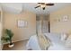 Bright bedroom featuring neutral tones, natural light, and closet access at 2662 S Cathay Way # 112, Aurora, CO 80013