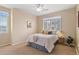 Bright bedroom featuring neutral tones, natural light, a ceiling fan, and a comfortable bed at 2662 S Cathay Way # 112, Aurora, CO 80013