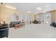 Comfortable clubhouse with plush seating, a dining table, and natural light from large windows at 2662 S Cathay Way # 112, Aurora, CO 80013