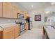 Well-equipped kitchen with stainless steel appliances, ample counter space, and light wood cabinetry at 2662 S Cathay Way # 112, Aurora, CO 80013