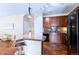 Stylish kitchen boasts an island with seating and stainless steel appliances at 2662 S Cathay Way # 112, Aurora, CO 80013