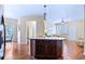 Kitchen island provides seating and leads into the open-concept living area at 2662 S Cathay Way # 112, Aurora, CO 80013