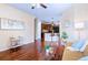 Open-concept living area boasts hardwood flooring, a kitchen view, and cozy seating at 2662 S Cathay Way # 112, Aurora, CO 80013