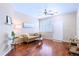 Inviting living room with hardwood flooring, a ceiling fan, and plantation shutters at 2662 S Cathay Way # 112, Aurora, CO 80013