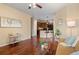 Open living area featuring wood floors and access to kitchen at 2662 S Cathay Way # 112, Aurora, CO 80013