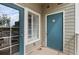 Patio with a blue accent door, window with shutters and a utility closet at 2662 S Cathay Way # 112, Aurora, CO 80013