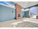 Outdoor covered area with a brick fireplace, offering a cozy spot by the pool at 2662 S Cathay Way # 112, Aurora, CO 80013