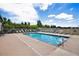 Relaxing community pool area with plenty of lounge chairs at 2662 S Cathay Way # 112, Aurora, CO 80013