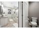 Modern bathroom with tiled shower and soaking tub, showcasing a clean and stylish design at 156 Chapel Hill Cir, Brighton, CO 80601