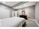 Comfortable bedroom with carpet, closet, and dark wood dresser with lamps at 156 Chapel Hill Cir, Brighton, CO 80601