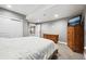 Basement bedroom featuring soft carpet, white doors, recessed lighting, and wood furniture at 156 Chapel Hill Cir, Brighton, CO 80601