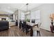 Inviting dining room with a modern chandelier and large windows, perfect for Gathering gatherings at 156 Chapel Hill Cir, Brighton, CO 80601