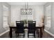 Bright dining room with a rustic table, modern lighting, and plenty of natural light for meals at 156 Chapel Hill Cir, Brighton, CO 80601