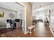 View of hallway featuring access to office and open concept floor plan at 156 Chapel Hill Cir, Brighton, CO 80601