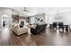 Bright living room featuring modern furniture, a fireplace, and hardwood floors for a comfortable living space at 156 Chapel Hill Cir, Brighton, CO 80601