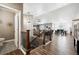 Spacious living area featuring an open floor plan with hardwood floors and modern decor at 156 Chapel Hill Cir, Brighton, CO 80601