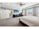 Main bedroom with tray ceiling, modern decor, and attached bathroom at 156 Chapel Hill Cir, Brighton, CO 80601
