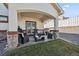 Covered patio offering a relaxing space with comfortable seating, ideal for enjoying the outdoors at 156 Chapel Hill Cir, Brighton, CO 80601