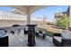 Cozy covered patio with outdoor seating and a grill, perfect for entertaining guests at 156 Chapel Hill Cir, Brighton, CO 80601