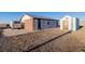 View of barn and outbuildings providing space for storage or hobbies, located on a flat landscape at 35055 E Mississippi Ave, Watkins, CO 80137