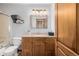 Well-maintained bathroom offering a soaking tub, vanity with storage, and a modern toilet at 35055 E Mississippi Ave, Watkins, CO 80137