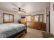 Cozy bedroom featuring warm wood accents, a large closet, and neutral tones for a relaxing retreat at 35055 E Mississippi Ave, Watkins, CO 80137
