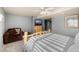 Serene bedroom featuring a comfortable chair, wooden dresser, and ceiling fan for added comfort at 35055 E Mississippi Ave, Watkins, CO 80137