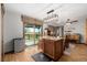 This bright kitchen features an island and sliding door leading to the outdoor deck, perfect for entertaining at 35055 E Mississippi Ave, Watkins, CO 80137