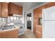 Functional kitchen features classic appliances, ample cabinet space, and an adjoining area at 35055 E Mississippi Ave, Watkins, CO 80137