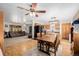 Bright kitchen and dining area featuring modern appliances, a large island, and hardwood floors for a warm feel at 35055 E Mississippi Ave, Watkins, CO 80137