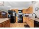 Well-lit kitchen boasts stainless steel appliances, granite countertops, and ample cabinet space for culinary enthusiasts at 35055 E Mississippi Ave, Watkins, CO 80137