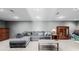 Cozy living room featuring a comfortable sectional sofa, wooden cabinets and neutral decor at 35055 E Mississippi Ave, Watkins, CO 80137