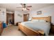 Inviting main bedroom showcasing a large bed, natural light, and an ensuite bathroom for added convenience at 35055 E Mississippi Ave, Watkins, CO 80137