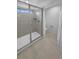 Modern bathroom features glass shower, tile flooring and private toilet at 950 Avena Ct, Elizabeth, CO 80107