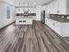 Spacious kitchen features white cabinets, stainless steel appliances, granite countertops, and an island with pendant lighting at 950 Avena Ct, Elizabeth, CO 80107