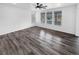 Spacious living area with hardwood floors and ample natural light from large windows at 950 Avena Ct, Elizabeth, CO 80107