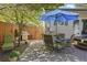 Landscaped patio with outdoor furniture, a grill, and a large umbrella for shade at 1250 S Josephine St, Denver, CO 80210