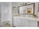 Bathroom with a double vanity, modern lighting, large mirror and a shower/tub combo at 1250 S Josephine St, Denver, CO 80210