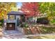 Charming two-story home with mature trees, driveway, and landscaped front yard at 1250 S Josephine St, Denver, CO 80210