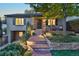 Charming home featuring inviting front porch, lush landscaping, and brick walkway at 1250 S Josephine St, Denver, CO 80210