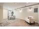 Finished basement area with neutral tones, plush seating, and a dining set at 5150 Buckingham Rd, Boulder, CO 80301