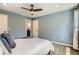 A cozy bedroom with wood flooring and light blue walls, offering a serene and calming atmosphere at 5150 Buckingham Rd, Boulder, CO 80301