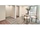 Bright dining area featuring a glass table, plush chairs, and stylish floor coverings at 5150 Buckingham Rd, Boulder, CO 80301